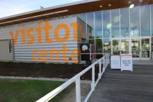 building with sign visitors center