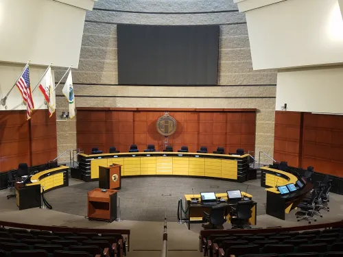 Image is the inside of the city council office, within has desks.