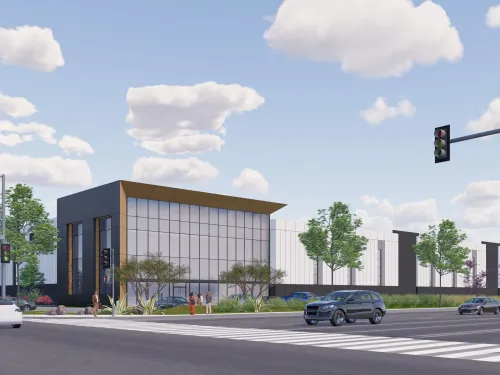 Rendering of forthcoming Irvine Fieldhouse with dark panels and large windows at a city intersection.